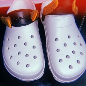 Crocs Men’s  White Clogs with Black and Orange Accents